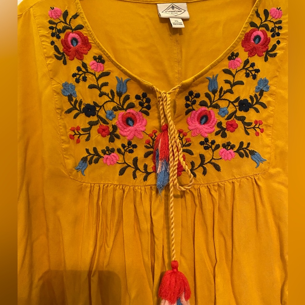 Women’s mustard colored top with embroidered flowers